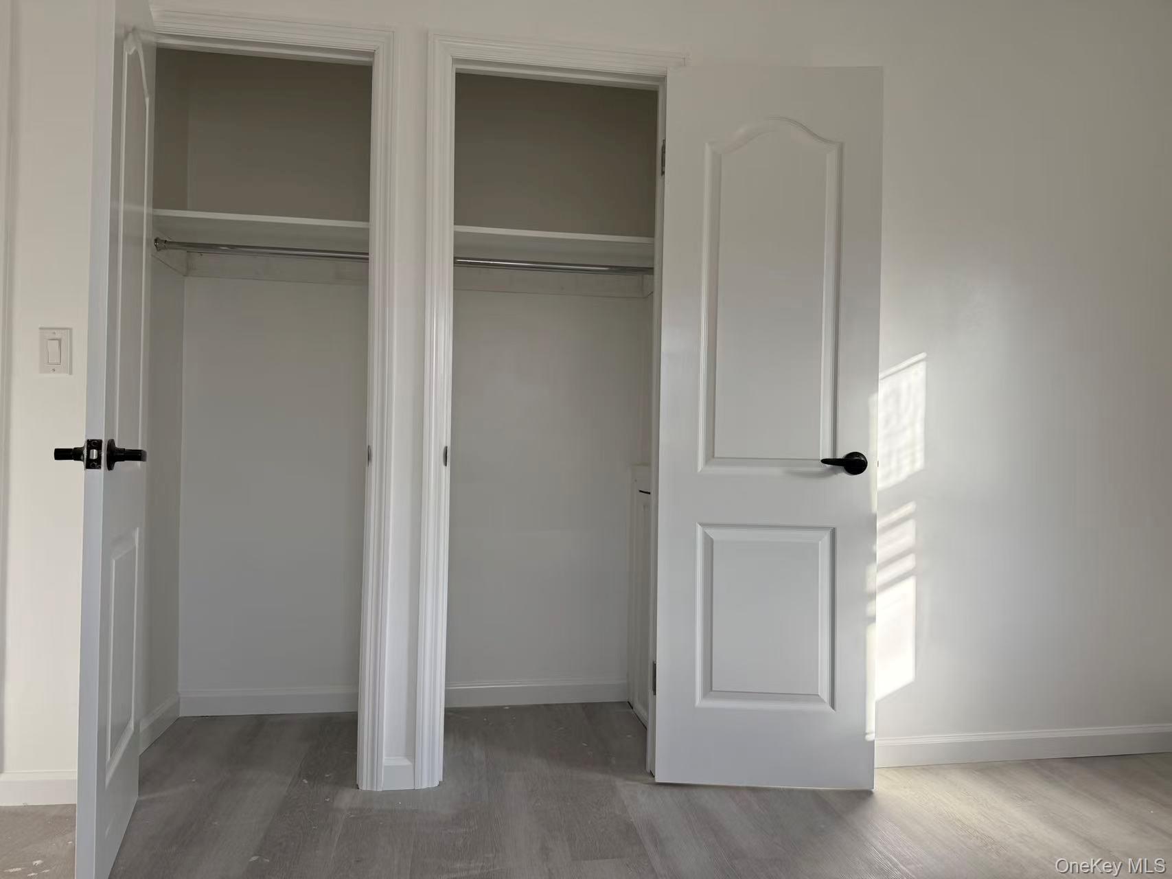 40-14 190th Street, Unit 2 Queens, NY 11358 - Photo 4 of 6 an empty room with windows