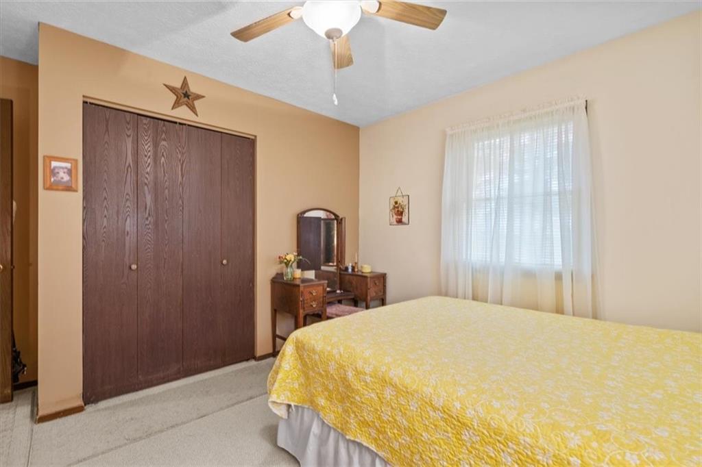 173 Amsterdam Road Grove City, PA 16127 - Photo 13 of 25 a bedroom with a bed and a dresser