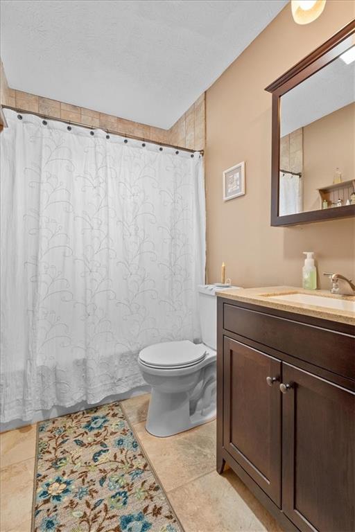 173 Amsterdam Road Grove City, PA 16127 - Photo 14 of 25 a bathroom with a granite countertop sink toilet and shower