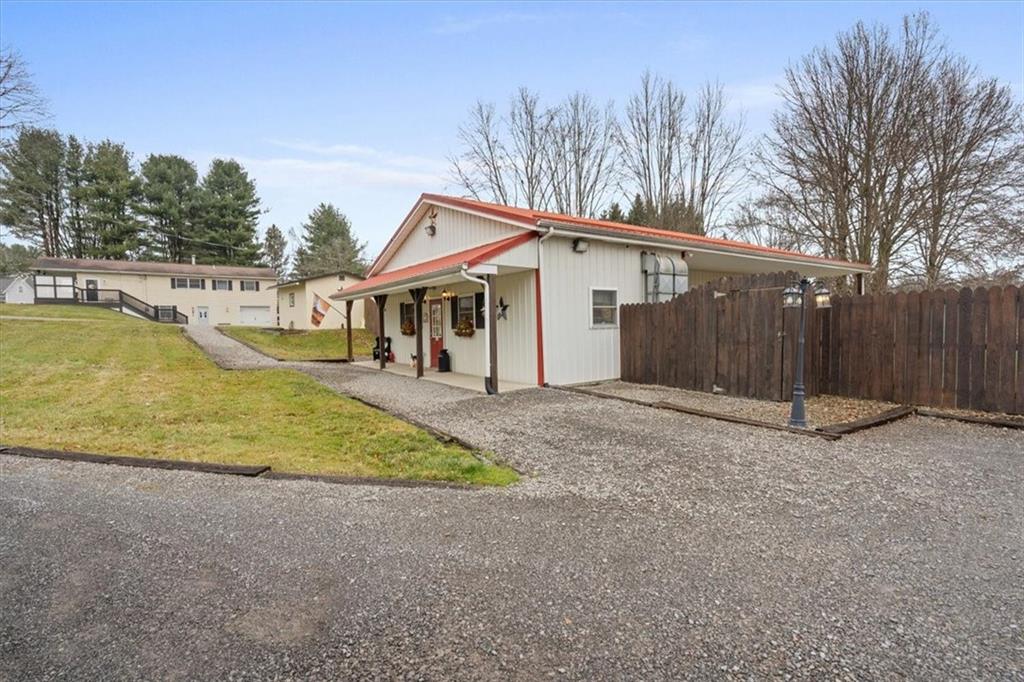 173 Amsterdam Road Grove City, PA 16127 - Photo 18 of 25 a view of a house with a yard and garage