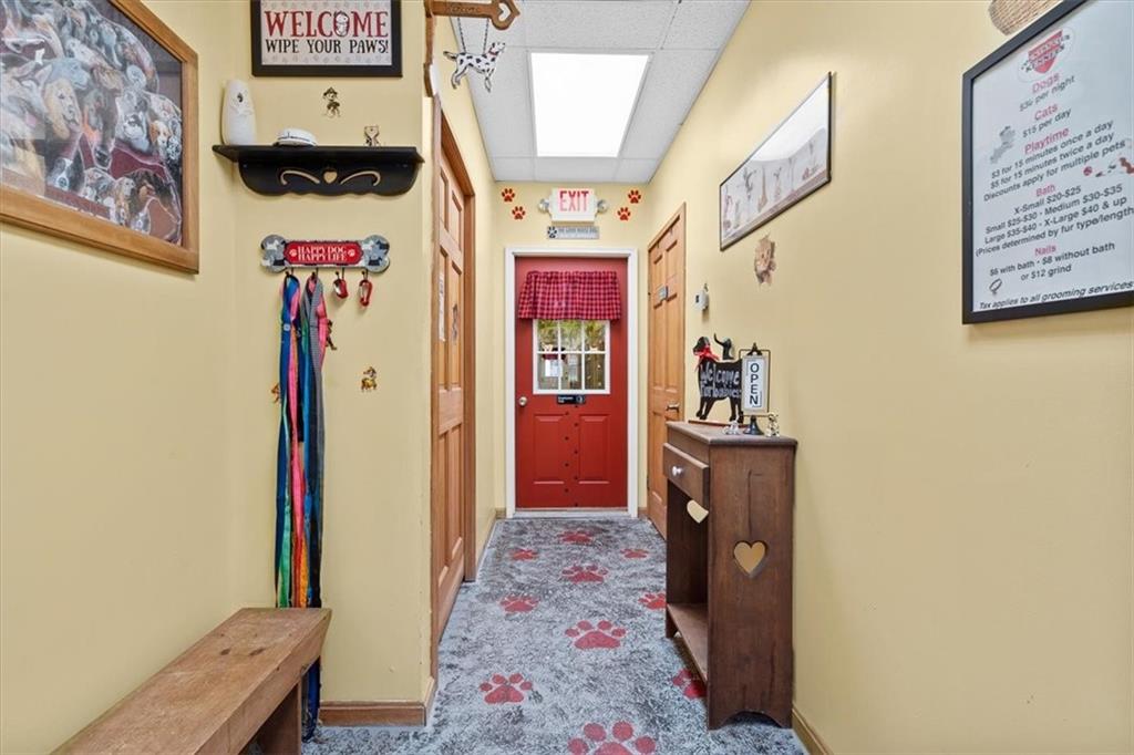 173 Amsterdam Road Grove City, PA 16127 - Photo 19 of 25 a hallway with beautiful frames and flower vase
