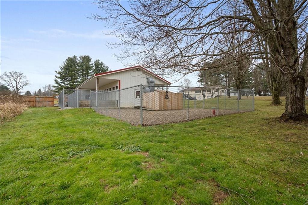 173 Amsterdam Road Grove City, PA 16127 - Photo 24 of 25 a view of a house with a back yard