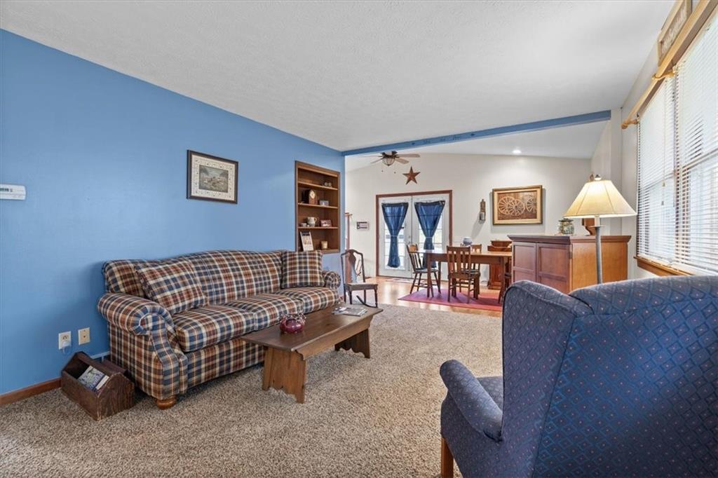 173 Amsterdam Road Grove City, PA 16127 - Photo 6 of 25 a living room with furniture and a wooden floor
