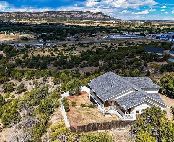 an aerial view of residential houses with outdoor space