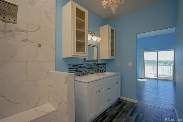 a view of a bathroom with sink and mirror