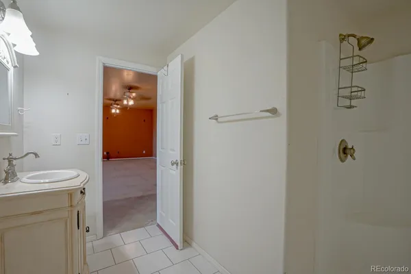 a bathroom with a sink and mirror