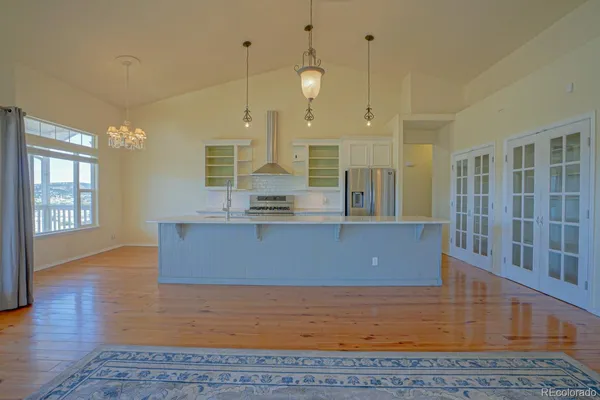 a view of kitchen and wooden floor