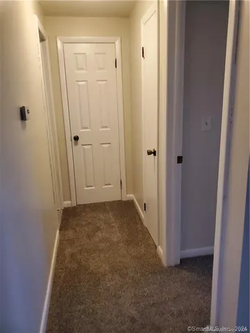 a view of hallway with closet