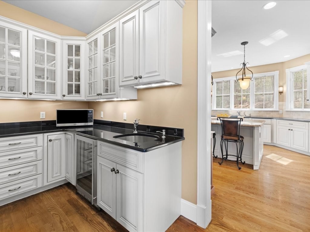 2 Copperbeech Circle Westborough, MA 01581 - Photo 11 of 42 a kitchen with stainless steel appliances granite countertop a stove and a white cabinets