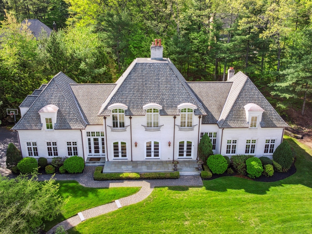 2 Copperbeech Circle Westborough, MA 01581 - Photo 2 of 42 a aerial view of a house with a yard table and chairs