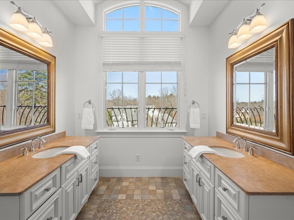 2 Copperbeech Circle Westborough, MA 01581 - Photo 24 of 42 a bathroom with a granite countertop sink a window and a bathtub