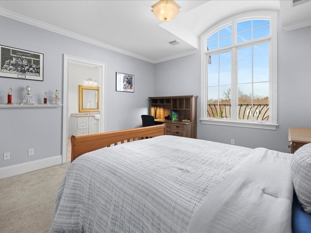 2 Copperbeech Circle Westborough, MA 01581 - Photo 27 of 42 a bedroom with a large bed and a window