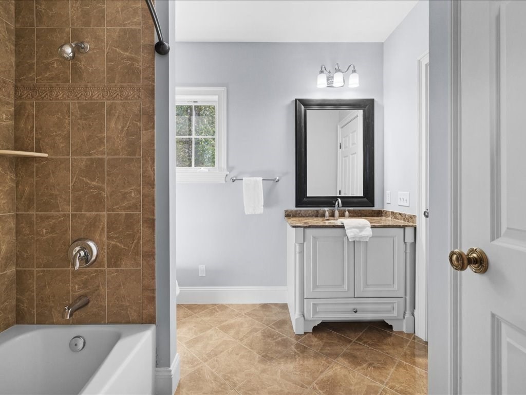 2 Copperbeech Circle Westborough, MA 01581 - Photo 29 of 42 a bathroom with a granite countertop sink a toilet and bathtub