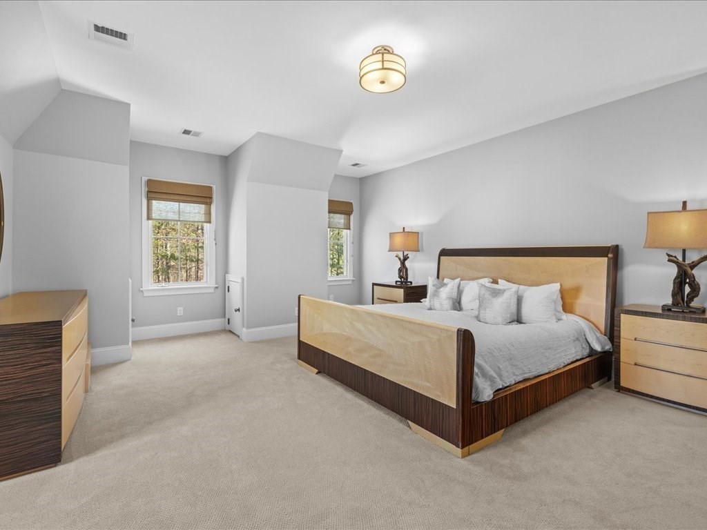 2 Copperbeech Circle Westborough, MA 01581 - Photo 33 of 42 a spacious bedroom with a bed and a lamp on dresser