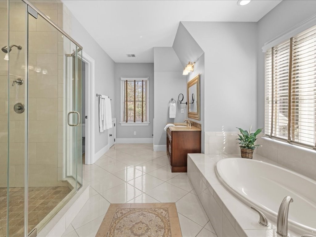 2 Copperbeech Circle Westborough, MA 01581 - Photo 35 of 42 a spacious bathroom with a tub shower and windows