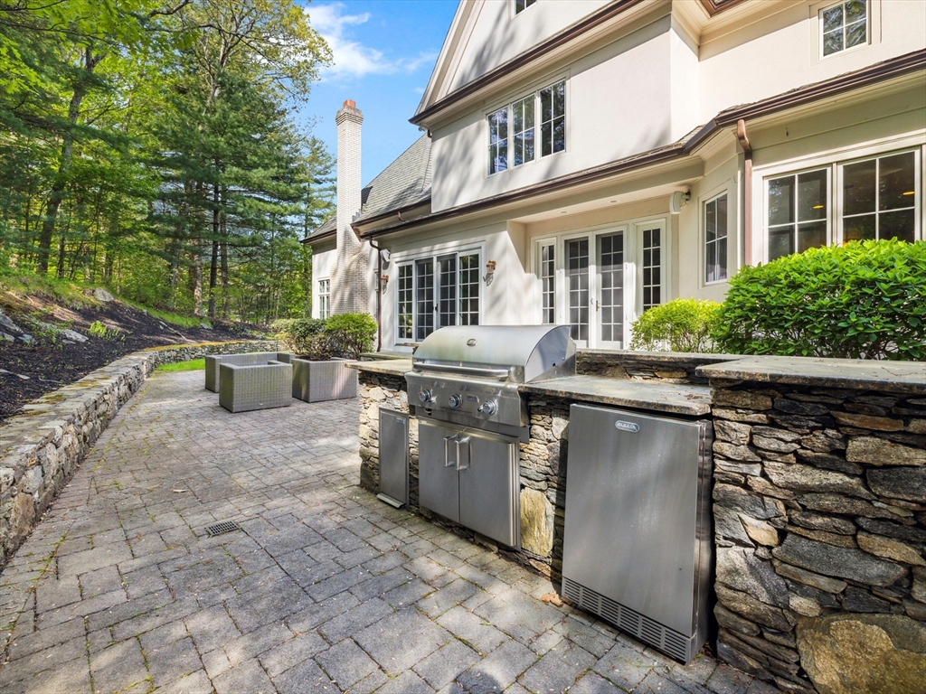 2 Copperbeech Circle Westborough, MA 01581 - Photo 38 of 42 a backyard of a house with yard and outdoor seating