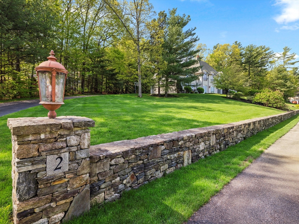 2 Copperbeech Circle Westborough, MA 01581 - Photo 40 of 42 a view of a garden with a fountain