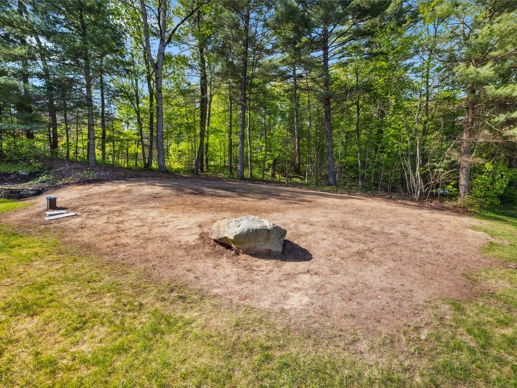 2 Copperbeech Circle Westborough, MA 01581 - Photo 42 of 42 a backyard of a house with trees and plants