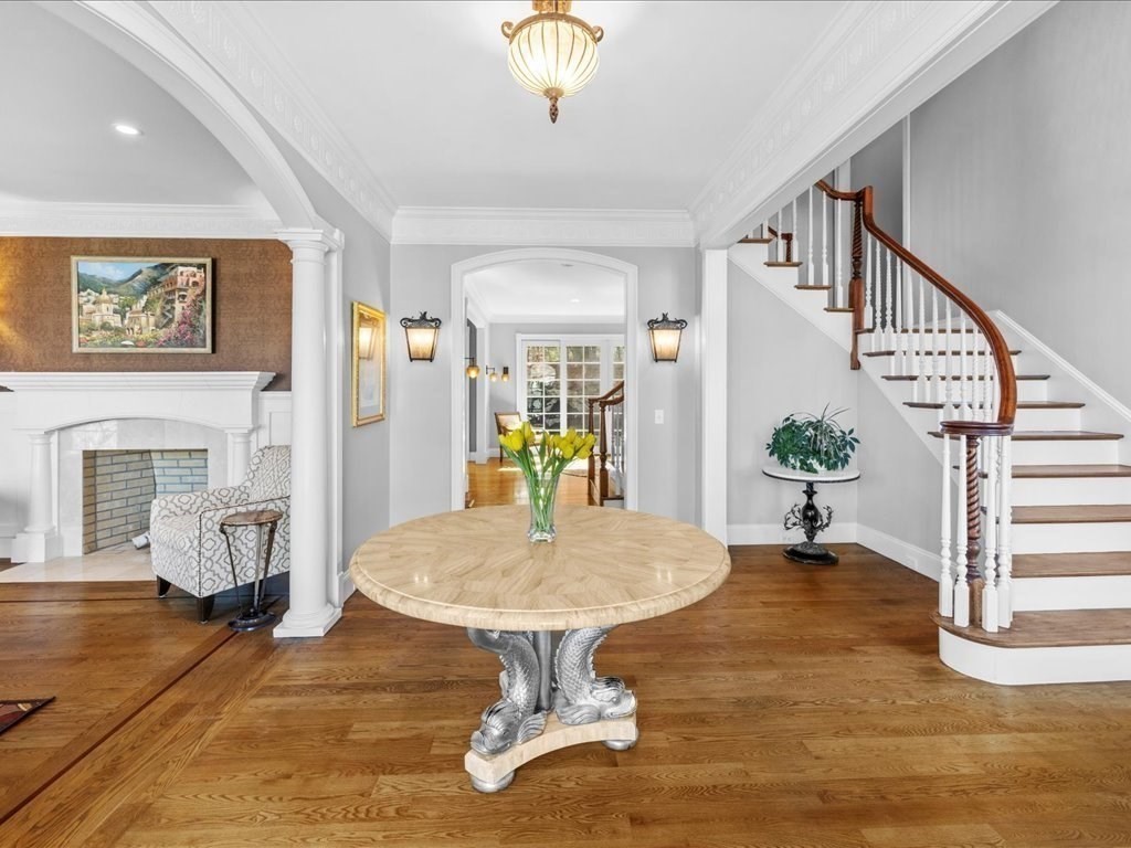 2 Copperbeech Circle Westborough, MA 01581 - Photo 5 of 42 a living room with furniture a dining table and a chandelier