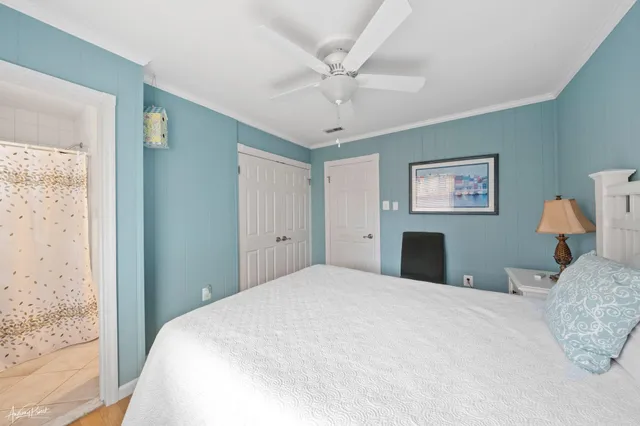 a bedroom with a large bed and a window