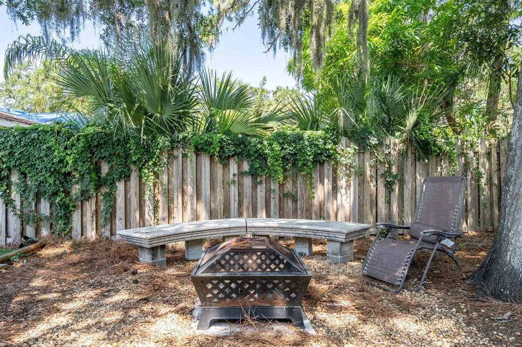 1317 13th Street, Unit B Sarasota, FL 34236 - Photo 14 of 36 a view of a small yard in front of a house with a fountain