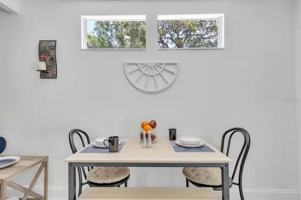 1317 13th Street, Unit B Sarasota, FL 34236 - Photo 16 of 36 a dining room with table and chair