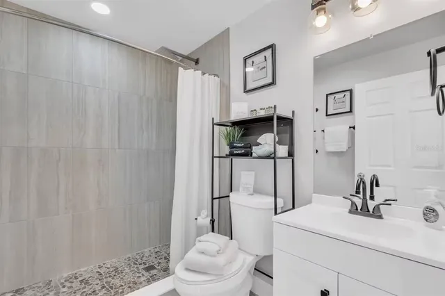 a bedroom with a bed and a lamp