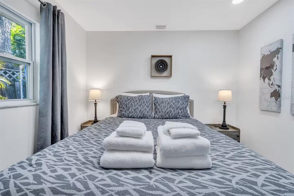 1317 13th Street, Unit B Sarasota, FL 34236 - Photo 19 of 36 a bedroom with a bed and a lamp