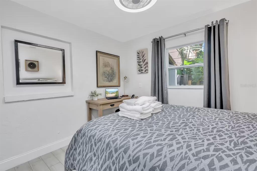 1317 Cocoanut Avenue, Unit B Sarasota, FL 34236 - Photo 21 of 36 a bedroom with a bed and a window