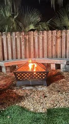 a kitchen with stainless steel appliances granite countertop a sink a stove and refrigerator