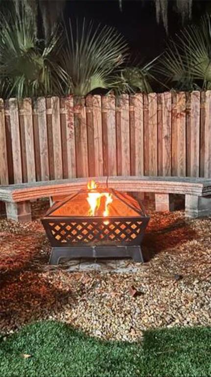 1317 13th Street, Unit B Sarasota, FL 34236 - Photo 22 of 36 a view of a backyard of a house with a large tree