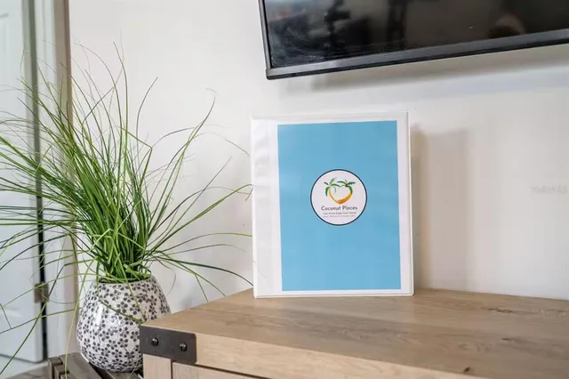 a front view of a house with a garden and parking