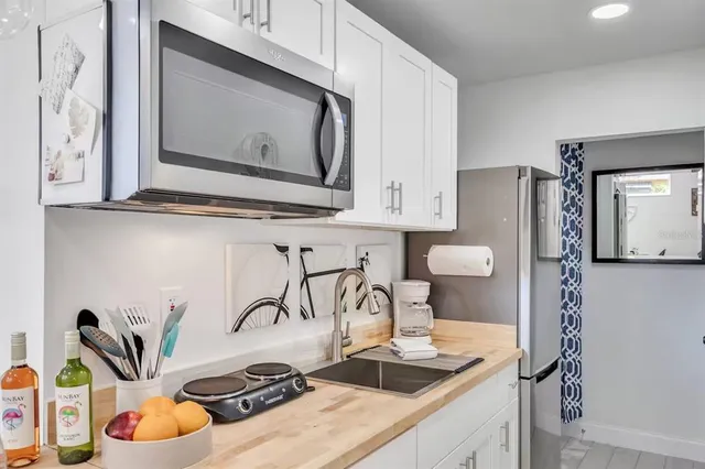 a kitchen with a stove and a microwave