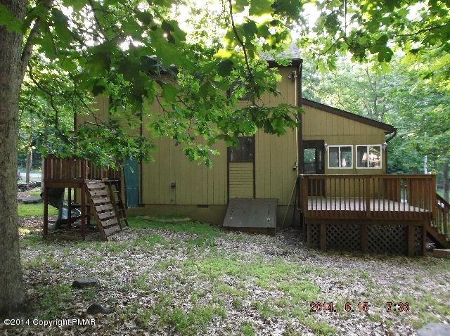 935 Decker Road Bushkill, PA 18324 - Photo 2 of 15 a view of a house with a yard and a tree