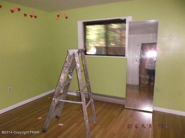 935 Decker Road Bushkill, PA 18324 - Photo 8 of 15 a view of a room with wooden floor