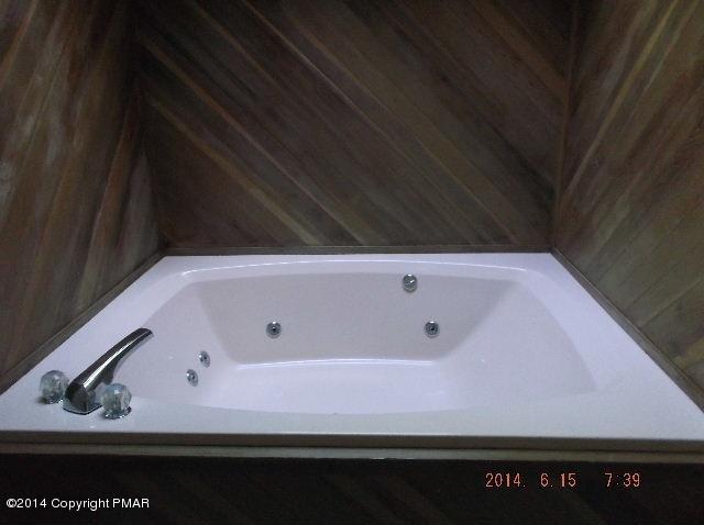 935 Decker Road Bushkill, PA 18324 - Photo 10 of 15 a bathroom with a bathtub