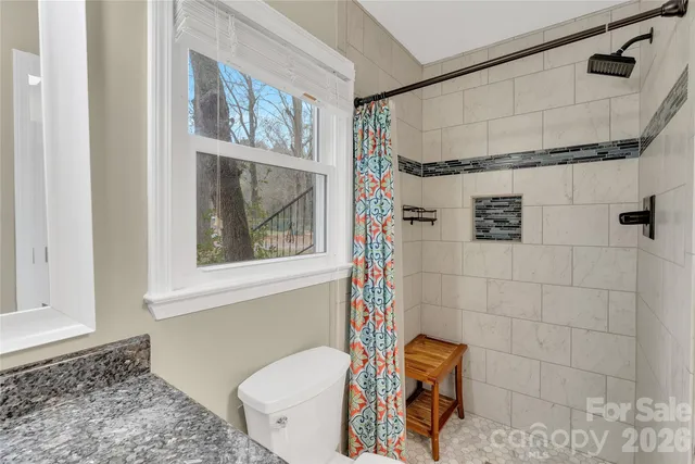 a bathroom with a bathtub and shower