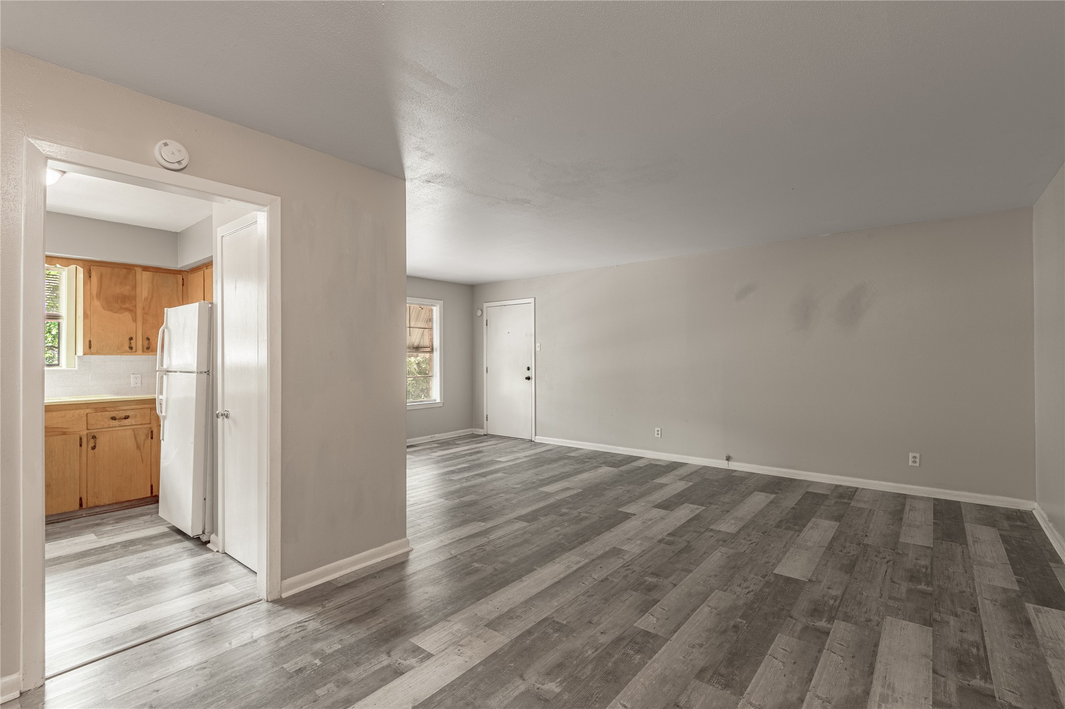 818 University Avenue, Unit 7 Huntsville, TX 77320 - Photo 11 of 25 wooden floor in an empty room