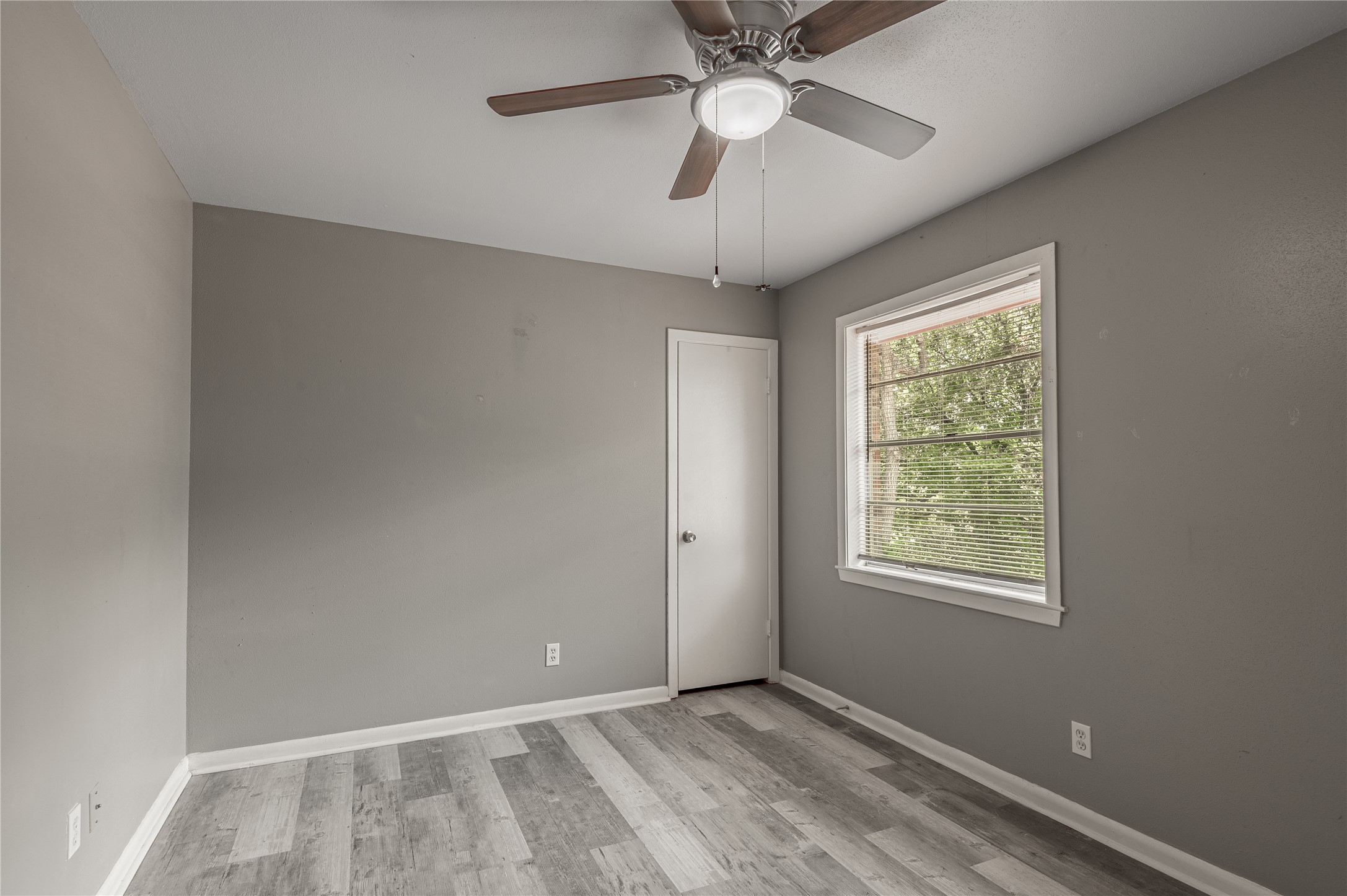 818 University Avenue, Unit 7 Huntsville, TX 77320 - Photo 20 of 25 a view of an empty room with a window