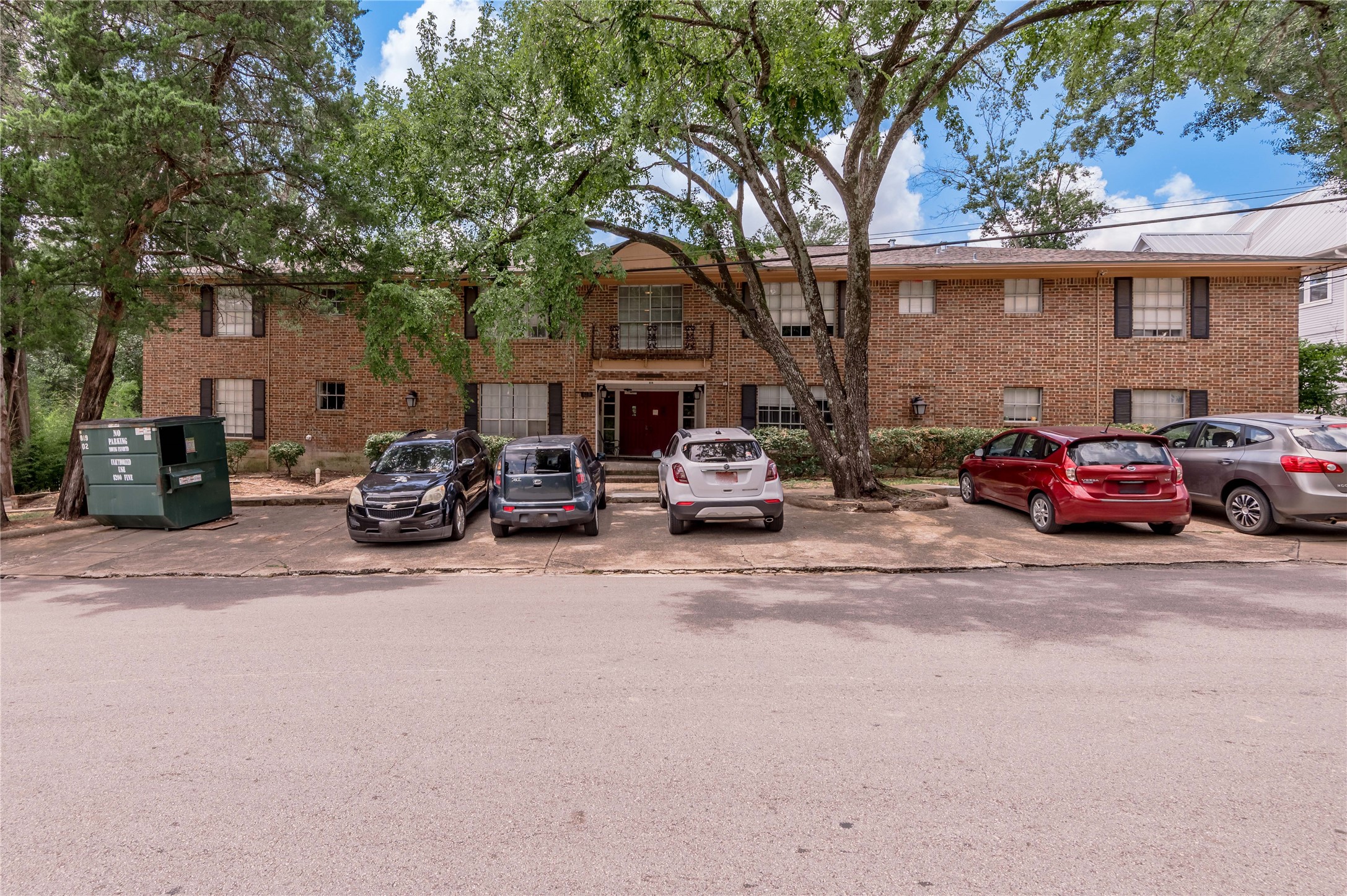 818 University Avenue, Unit 7 Huntsville, TX 77320 - Photo 2 of 25 a car parked in front of a building