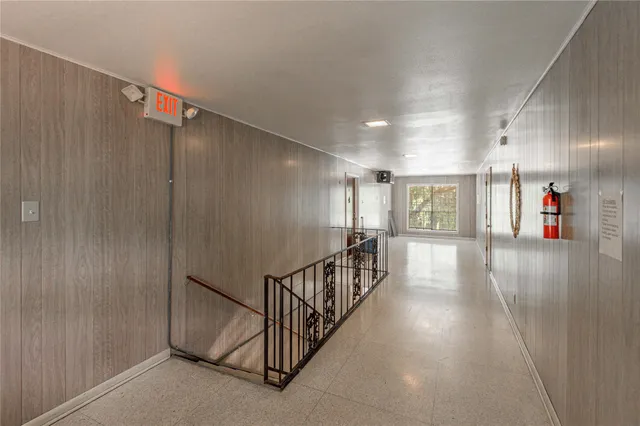 a view of a hallway with stairs