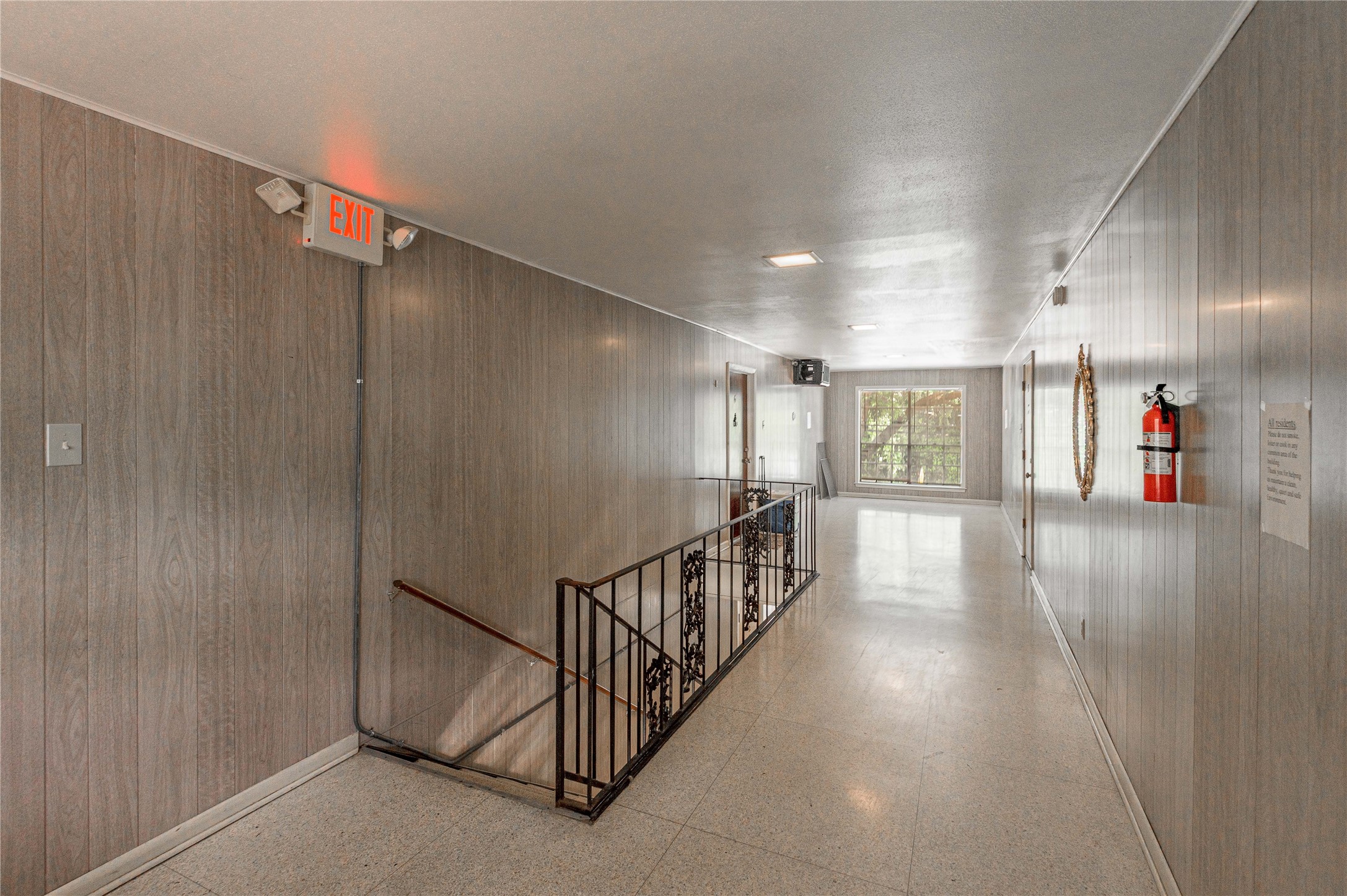 818 University Avenue, Unit 7 Huntsville, TX 77320 - Photo 6 of 25 a view of a hallway with stairs