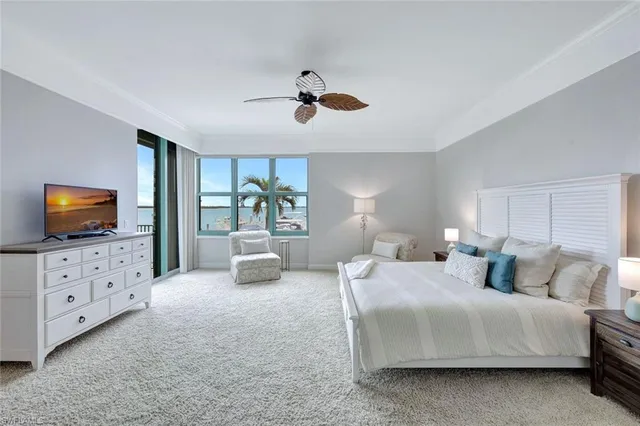 a bedroom with bed and window