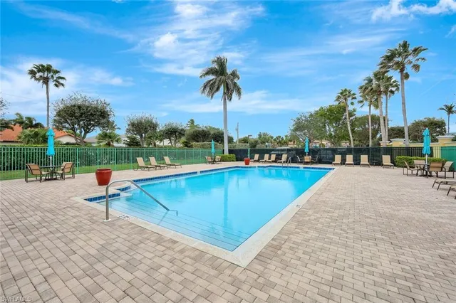 a view of a swimming pool with a lounge chairs