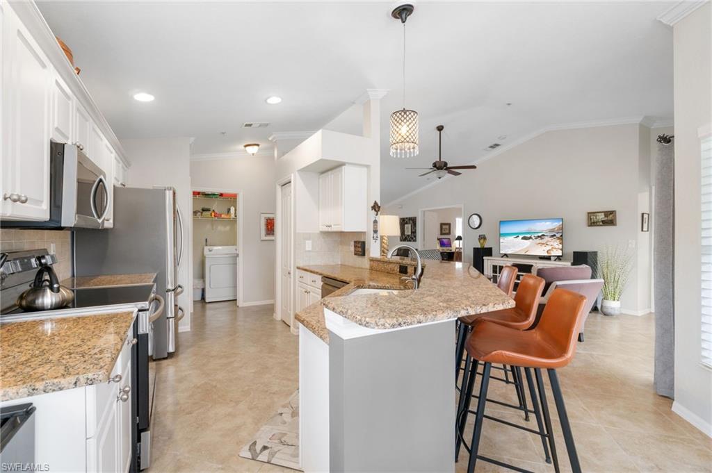 359 Dover Place, Unit E204 Naples, FL 34104 - Photo 13 of 49 a dining room filled counter top space and furniture