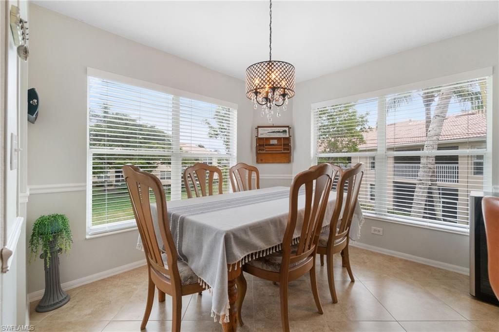 359 Dover Place, Unit E204 Naples, FL 34104 - Photo 19 of 49 a view of a dining room with furniture window and outside view