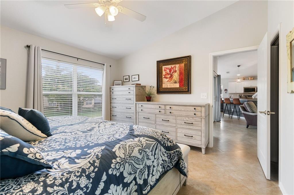 359 Dover Place, Unit E204 Naples, FL 34104 - Photo 22 of 49 a bedroom with a bed and a window