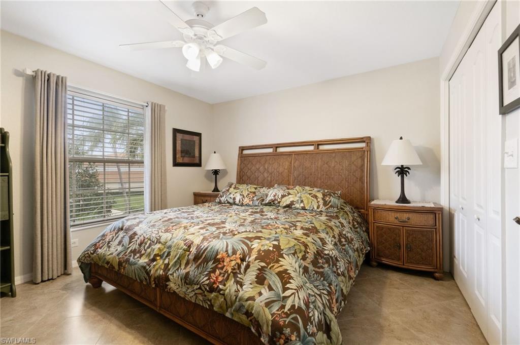 359 Dover Place, Unit E204 Naples, FL 34104 - Photo 27 of 49 a bedroom with a bed and window