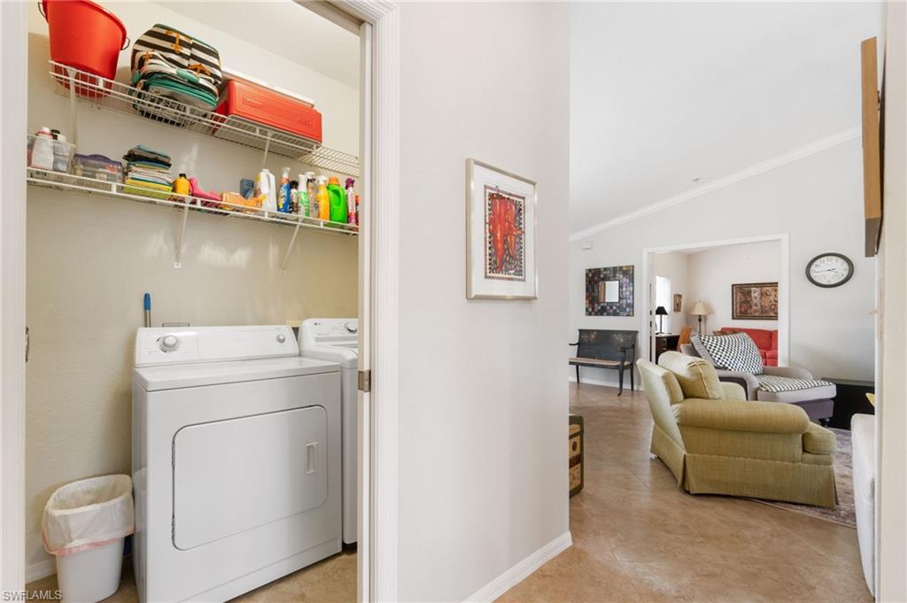 359 Dover Place, Unit E204 Naples, FL 34104 - Photo 30 of 49 a view of storage and utility room with washer and dryer