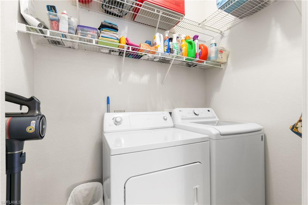 359 Dover Place, Unit E204 Naples, FL 34104 - Photo 31 of 49 a utility room with dryer and washer